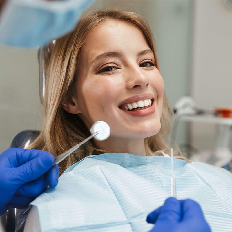 Smiling Woman with braces in office chair