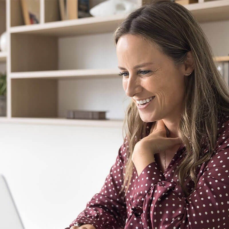 Adult Woman on computer researching financing options